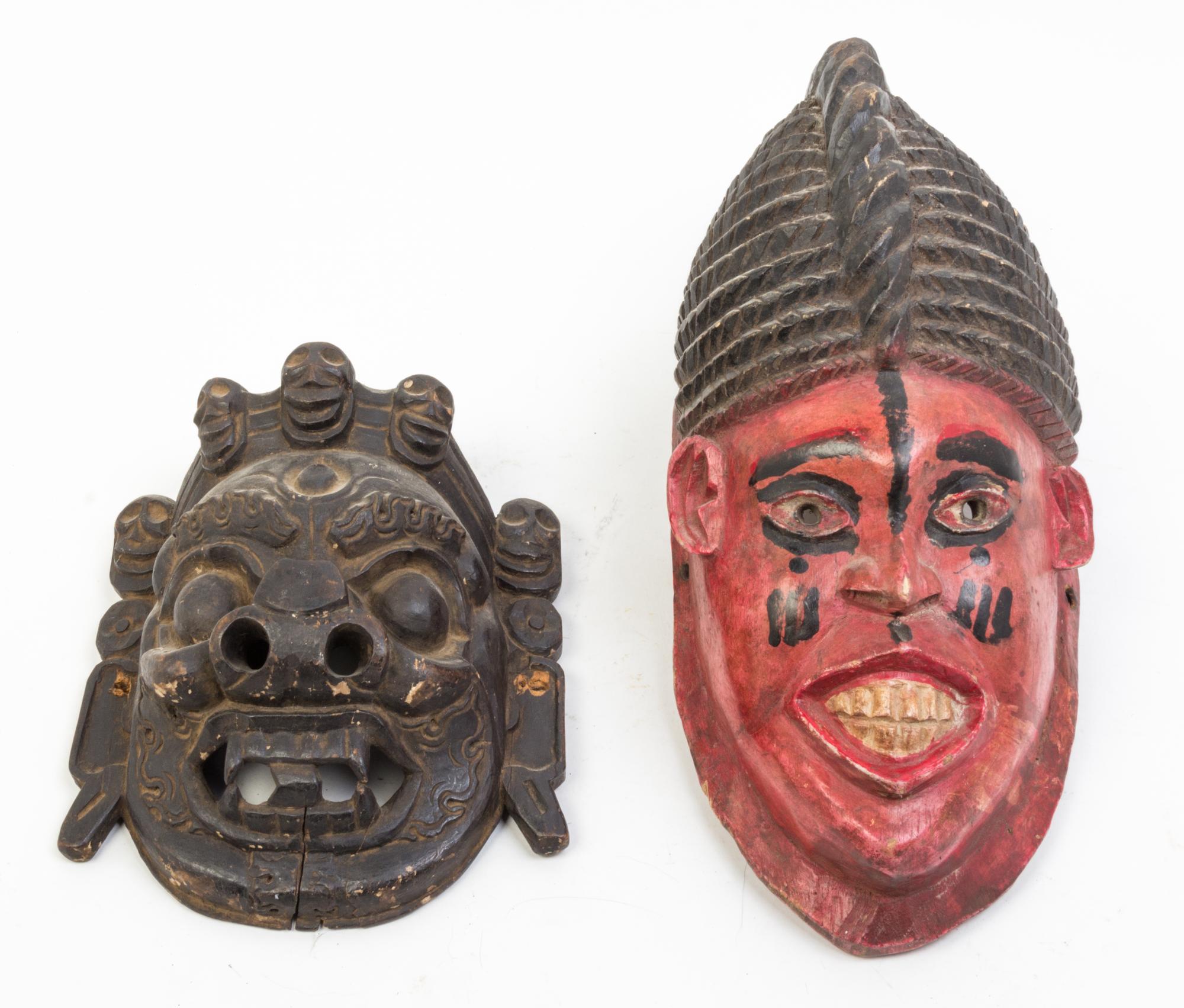 A Collection of Seven Masks Height of largest 17 inches.