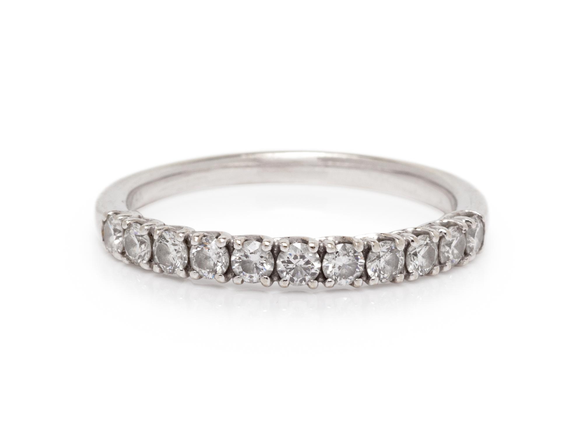 A 14 Karat White Gold and Diamond Ring,