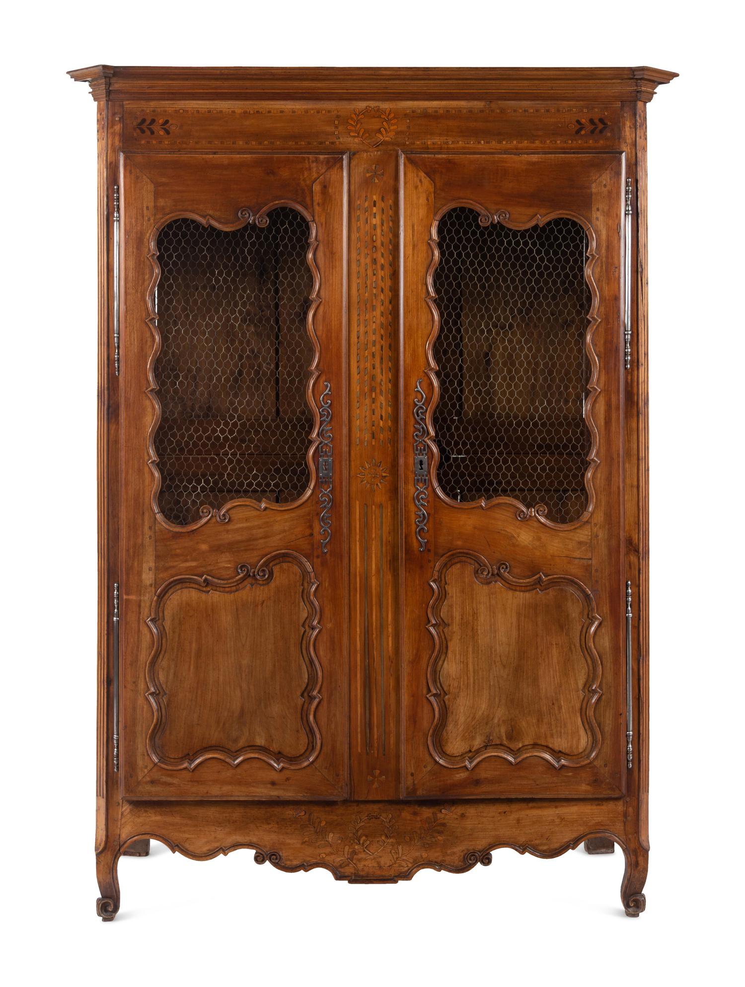A French Provincial Walnut Armoire