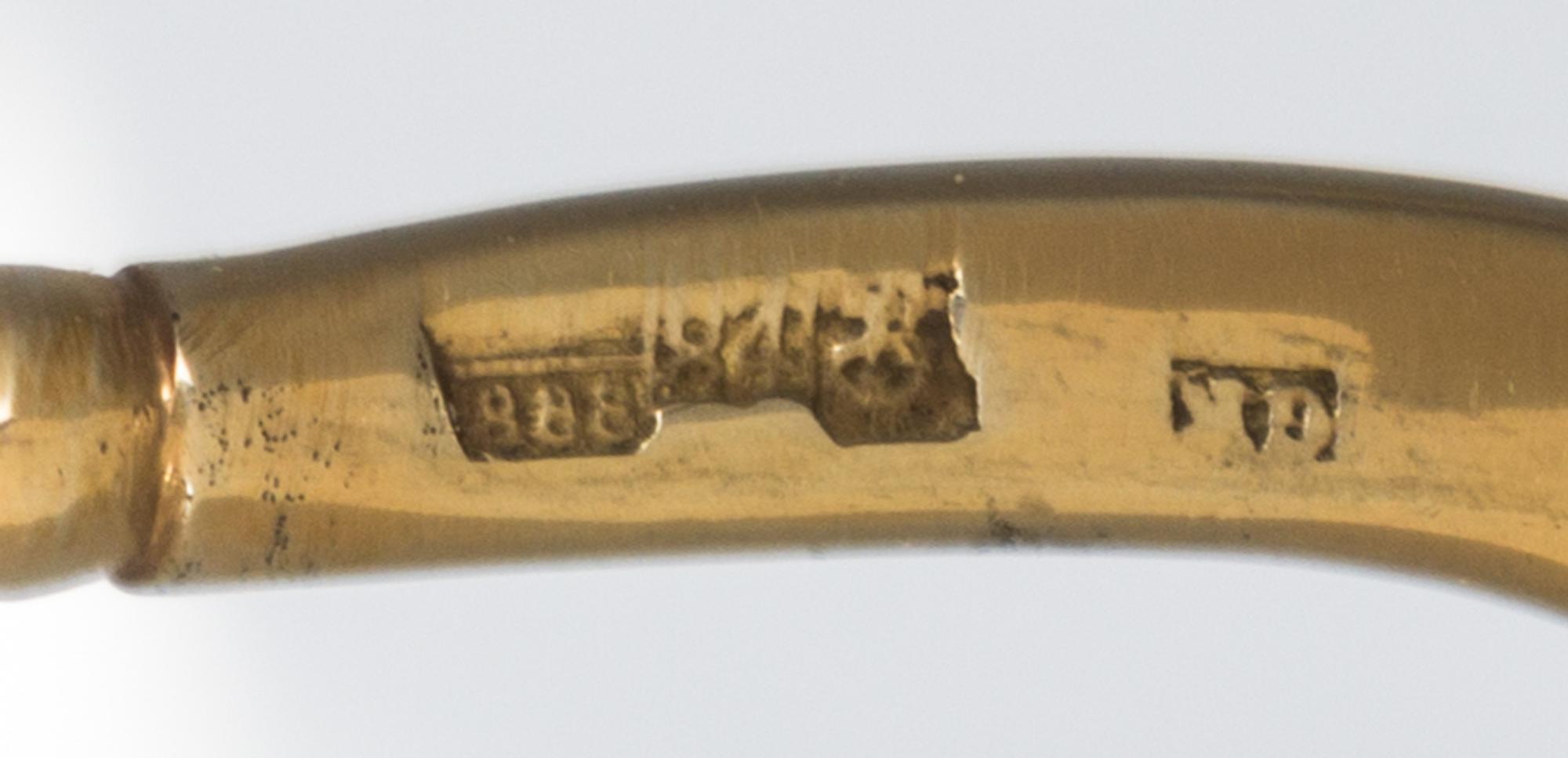 A Pair of Silver-Gilt and Enamel Spoons, Mark of Gustav Klingert, Moscow, 1888, each having a polychrome enameled finial on a twist han