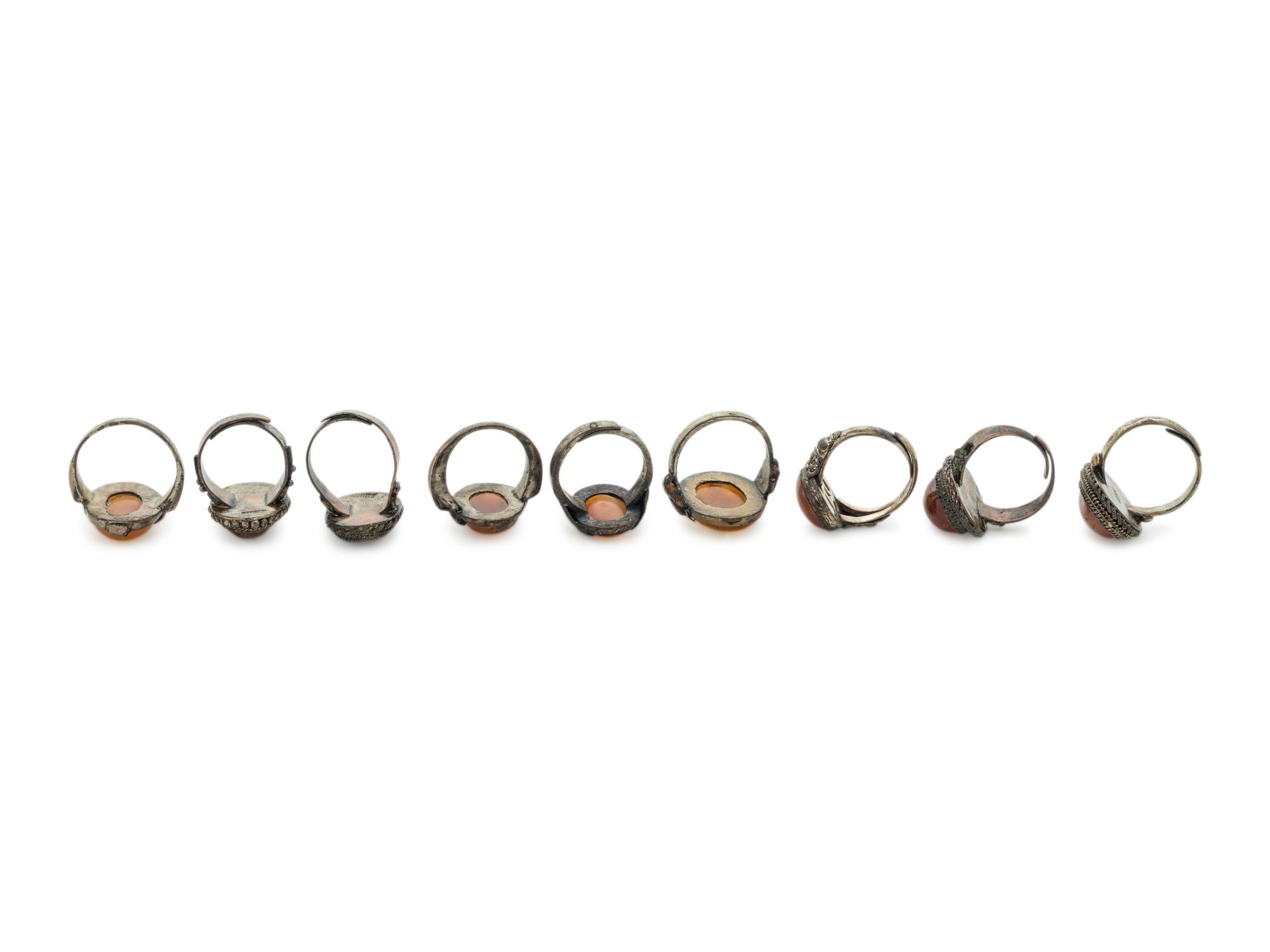 Nine Chinese Carnelian Agate Inset Metal Rings