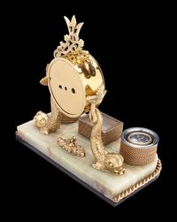 A Gilt Metal and Onyx Nautical Desk Clock, with Compass and Barometer