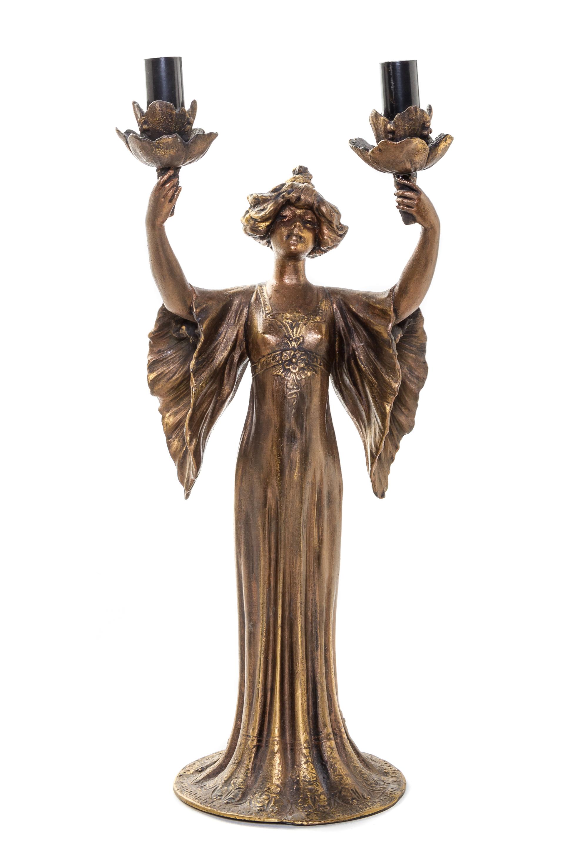An Art Nouveau Cast Metal Two-Light Newel Post Lamp, Height of figure 17 1/8 inches.