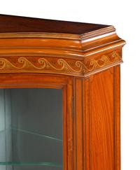 An Edwardian Satinwood and Marquetry Serpentine-Front Cabinet