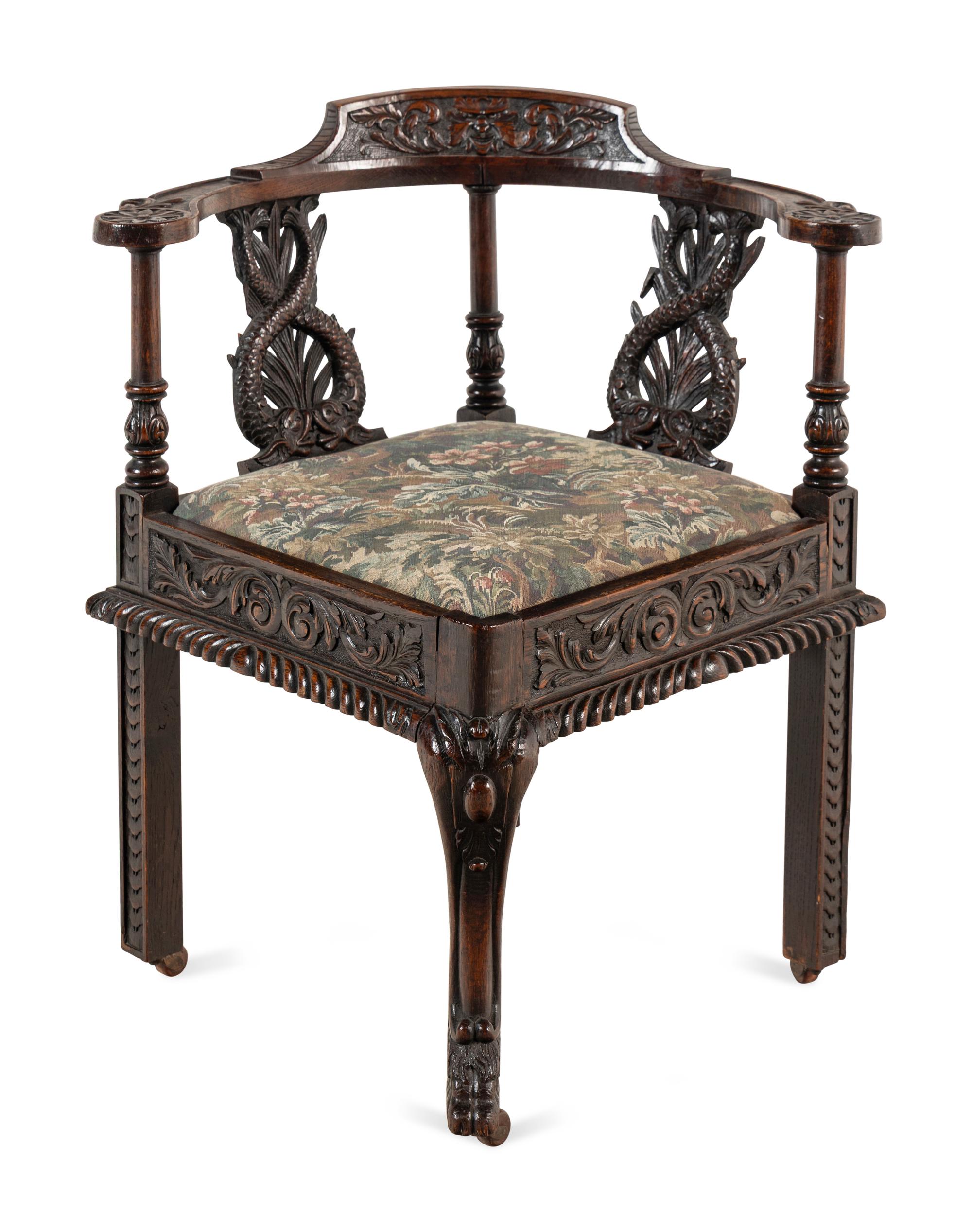 A Renaissance Revival Carved Oak Corner Chair