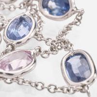 An 18 Karat White Gold Sapphire Station Necklace