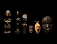 Three Dan Passport Masks, An Ashanti Wood Idol, and Two Wood Figures