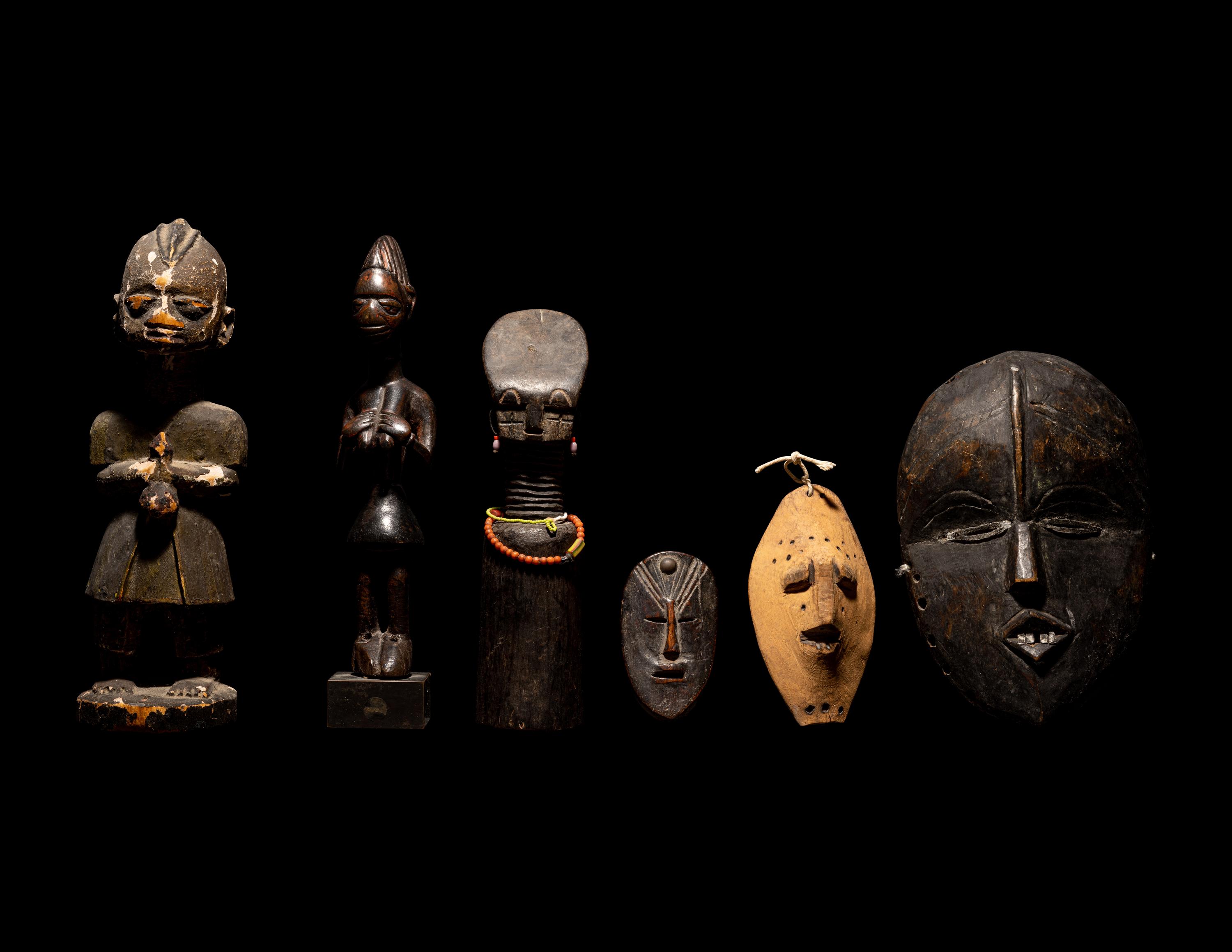 Three Dan Passport Masks, An Ashanti Wood Idol, and Two Wood Figures
