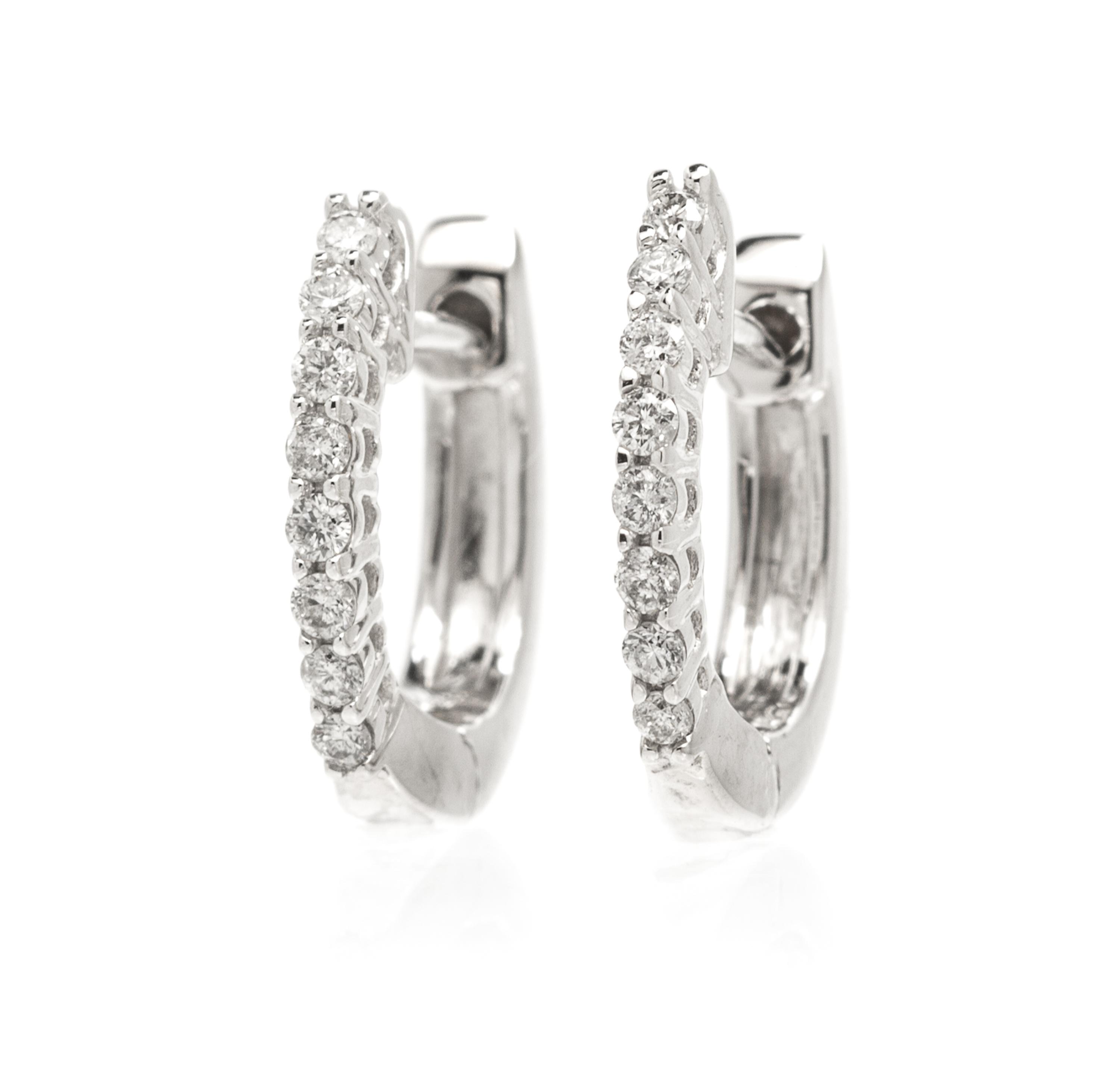 A Pair Of 14 Karat White Gold and Diamond Hoops, 1.40 dwts.