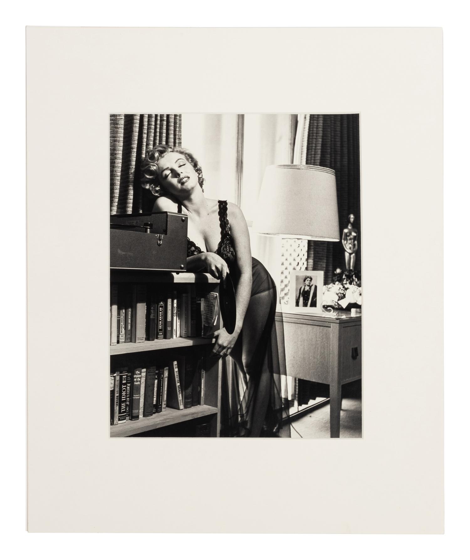 Philippe Halsman (1906-1979) Marilyn Monroe listening to music, 1952