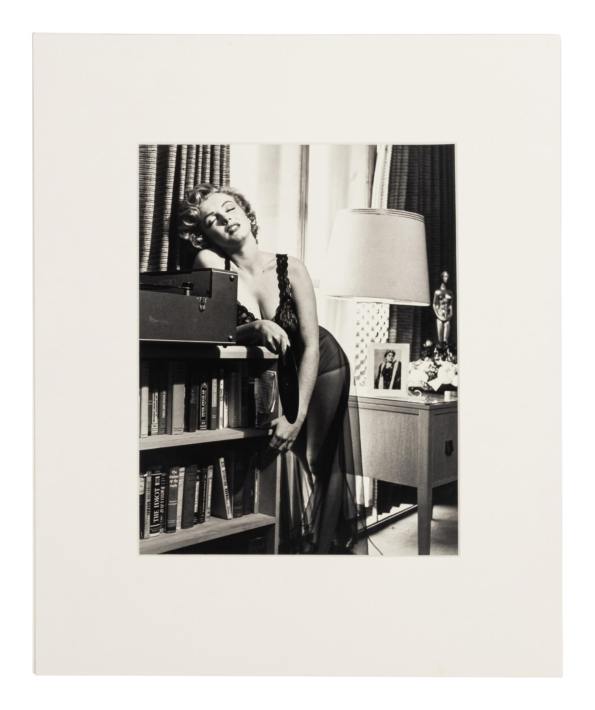 Philippe Halsman (1906-1979) Marilyn Monroe listening to music, 1952