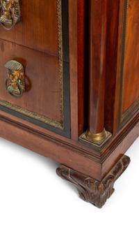 A Continental Egyptian Revival Gilt Metal Mounted Walnut Marble-Top Commode