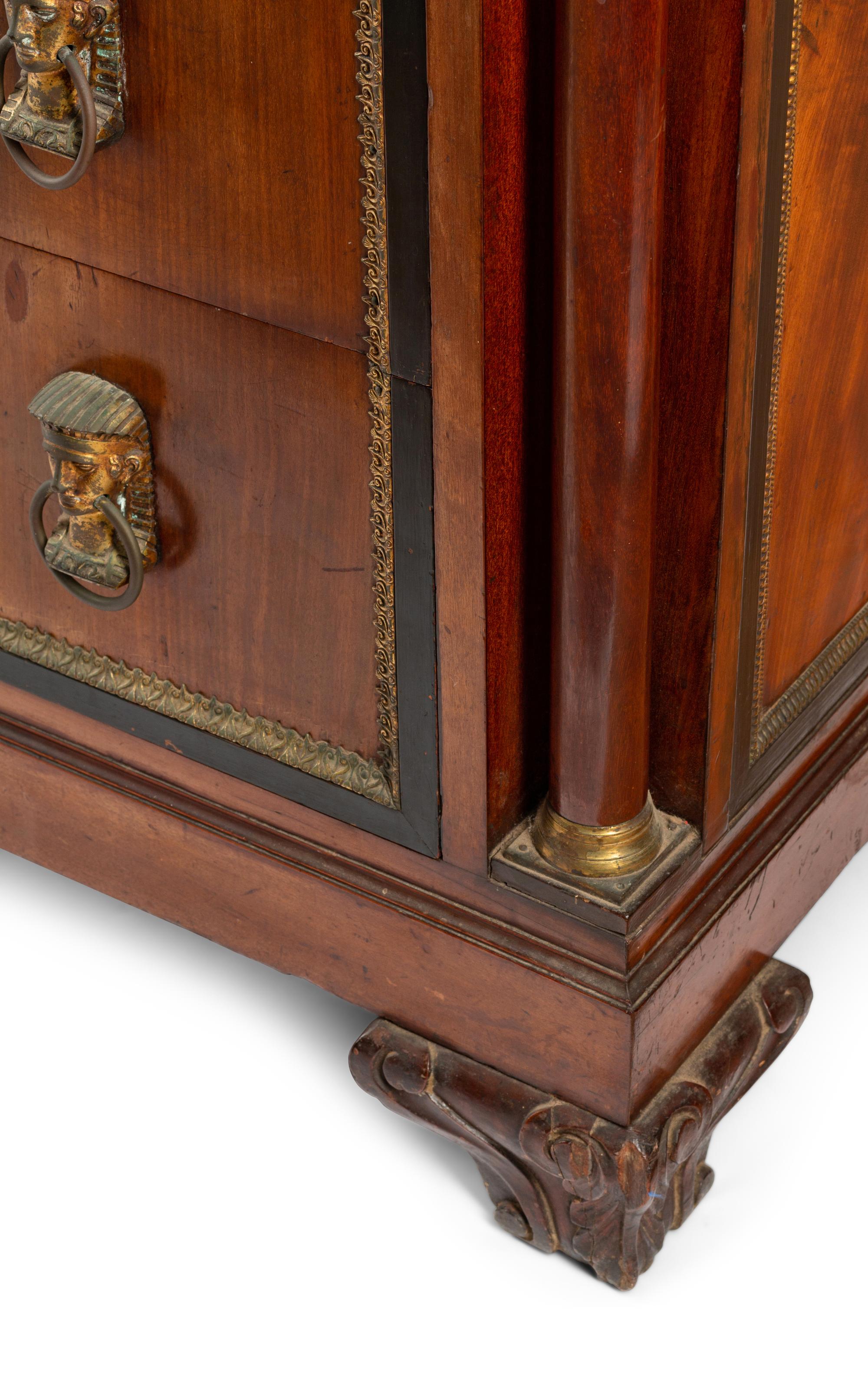 A Continental Egyptian Revival Gilt Metal Mounted Walnut Marble-Top Commode