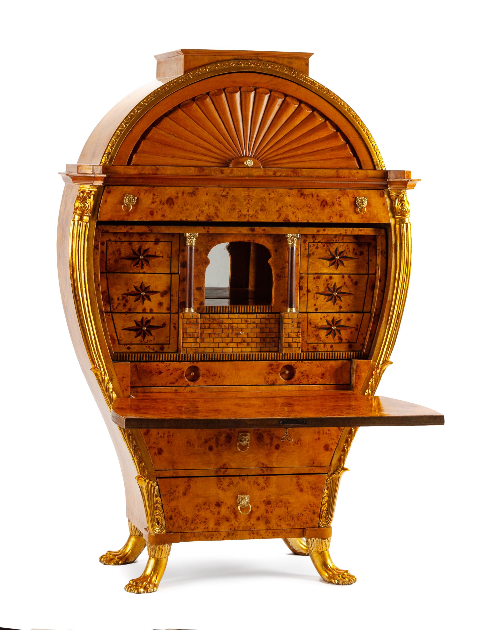 An Austrian Biedermeier Parcel Gilt Secretary Height 64 x width 43 1/2 x depth 18 inches.