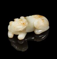 A Pale Celadon and Russet Jade Figure of a Mythical Beast Length 3 1/4 inches. — 19TH CENTURY