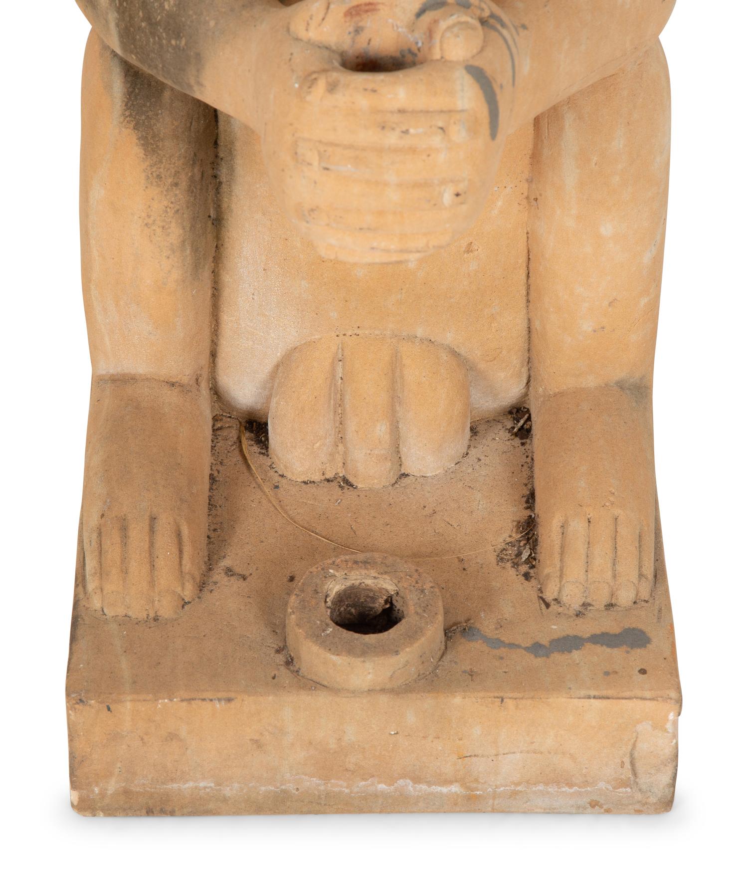 A Pair of Cast Stone Monkey-Form Torchere Holders
