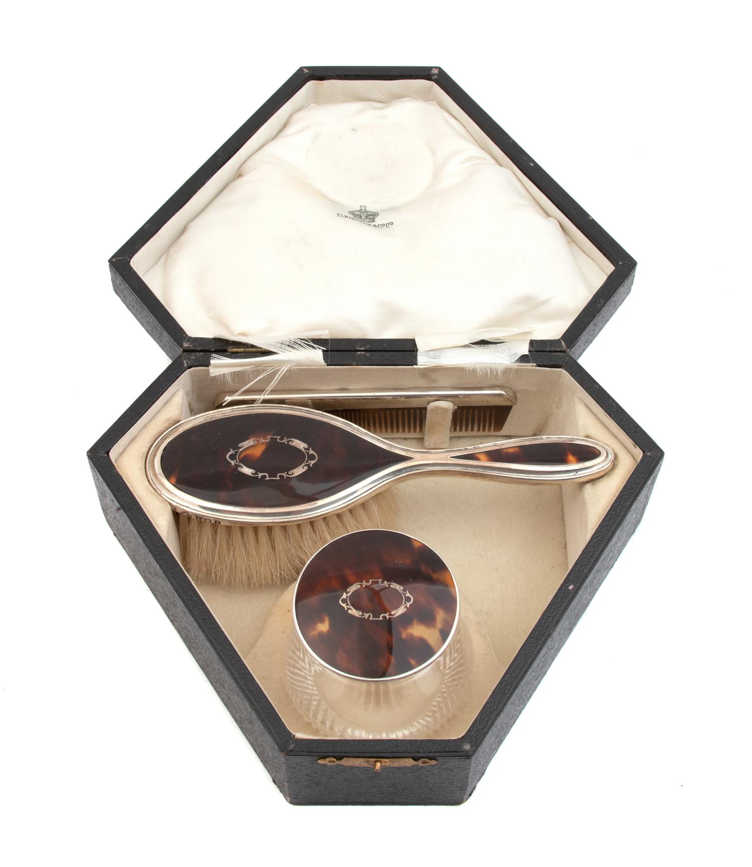An English Silver and Tortoise Shell Three-Piece Toiletry Set — Birmingham, 1925, Ellington & Sons