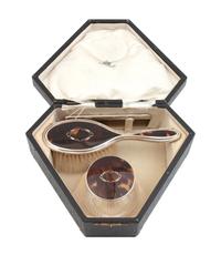 An English Silver and Tortoise Shell Three-Piece Toiletry Set — Birmingham, 1925, Ellington & Sons