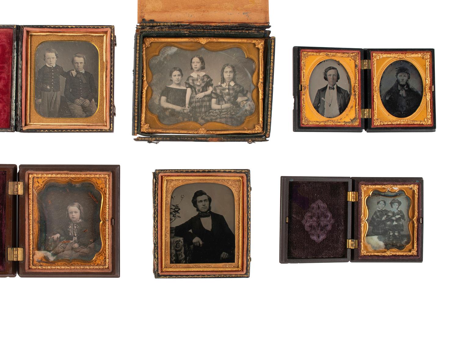 [EARLY PHOTOGRAPHY]. 21 cased images of men, women, and children, incl. children with props.