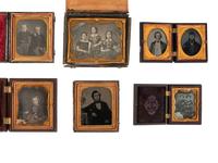 [EARLY PHOTOGRAPHY]. 21 cased images of men, women, and children, incl. children with props.