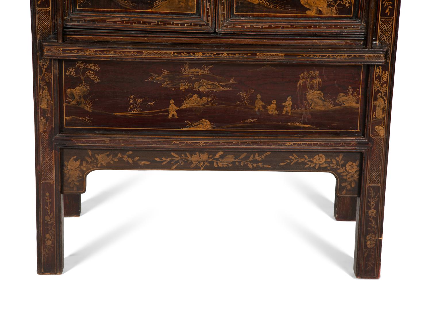 A Chinese Black Lacquer and Parcel Gilt Cabinet
