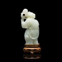 A Chinese Pale Celadon Jade Figure of a Boy, 18th-19th Century 清中期 青白玉 持蓮 童子