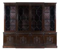 A Regency Carved Mahogany Breakfront Bookcase Height 110 x width 132 x depth 21 inches. — 19TH CENTURY