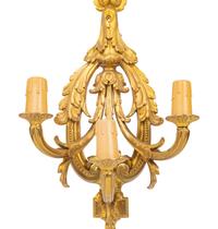 A Set of Four Louis XVI Style Gilt Metal Three-Light Sconces