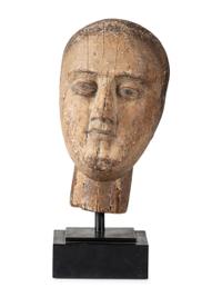 A Carved and Painted Wooden Head