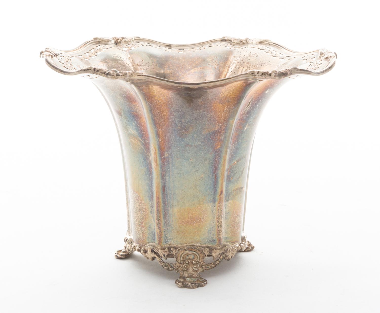 A Silver Footed Vase, , having an undulating rim with floral and pierced decoration.