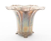 A Silver Footed Vase, , having an undulating rim with floral and pierced decoration.