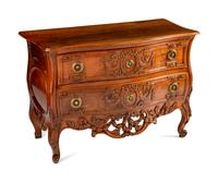 A Louis XV Provincial Carved Walnut Commode — LATE 18TH CENTURY
