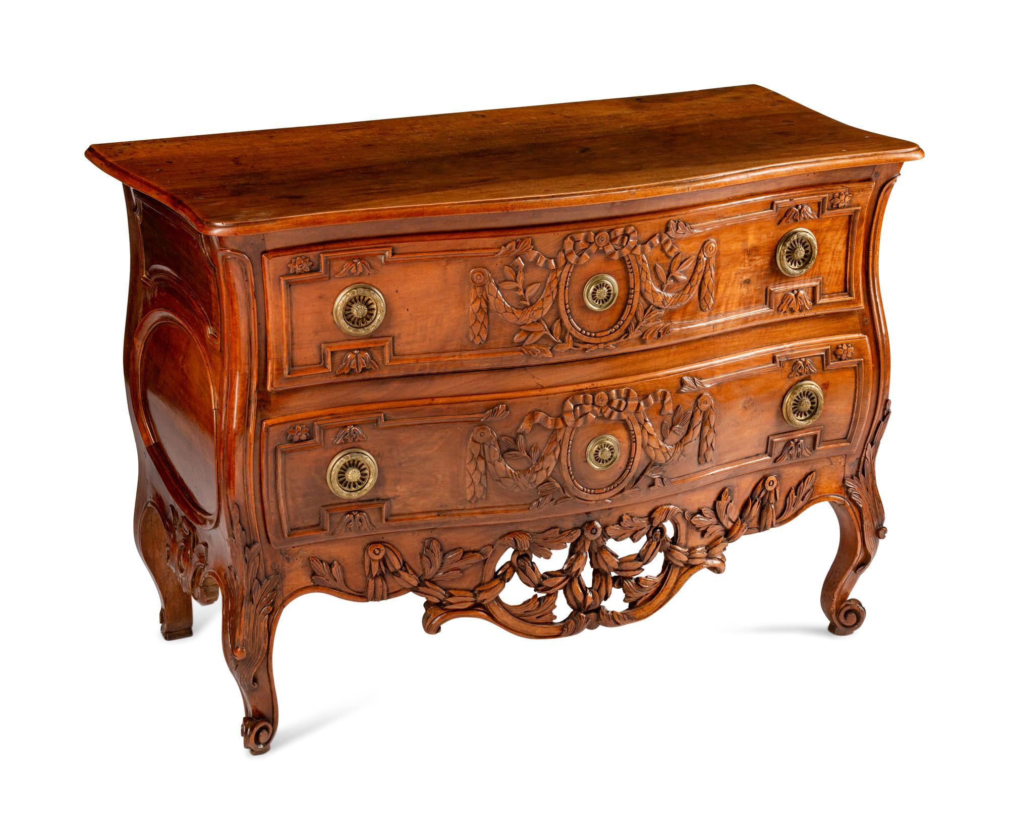 A Louis XV Provincial Carved Walnut Commode — LATE 18TH CENTURY