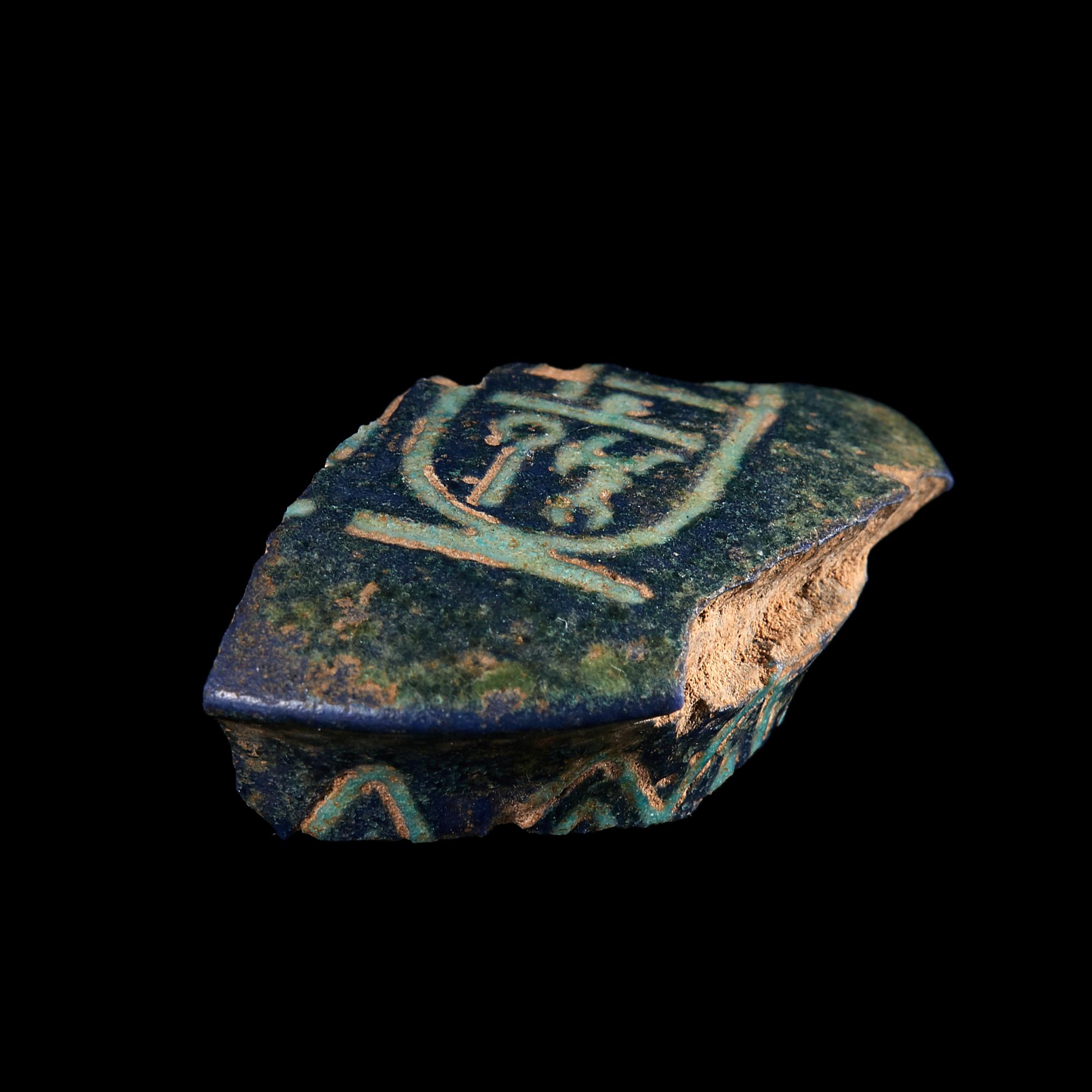 An Egyptian Bichrome-Faience Djed Pillar Fragment with the Cartouche of Amenhotep III