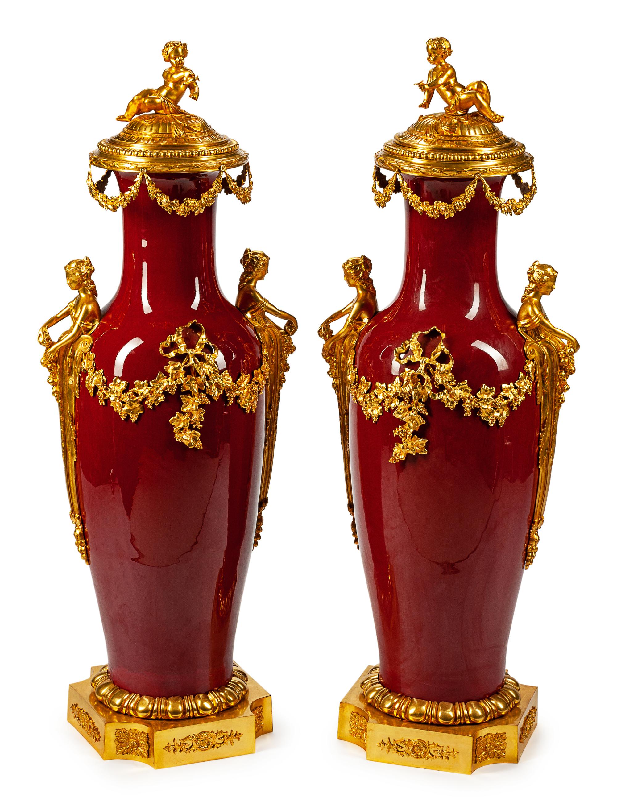 A Monumental Pair of Gilt-Bronze-Mounted Sang de Bouef Porcelain Vases and Covers