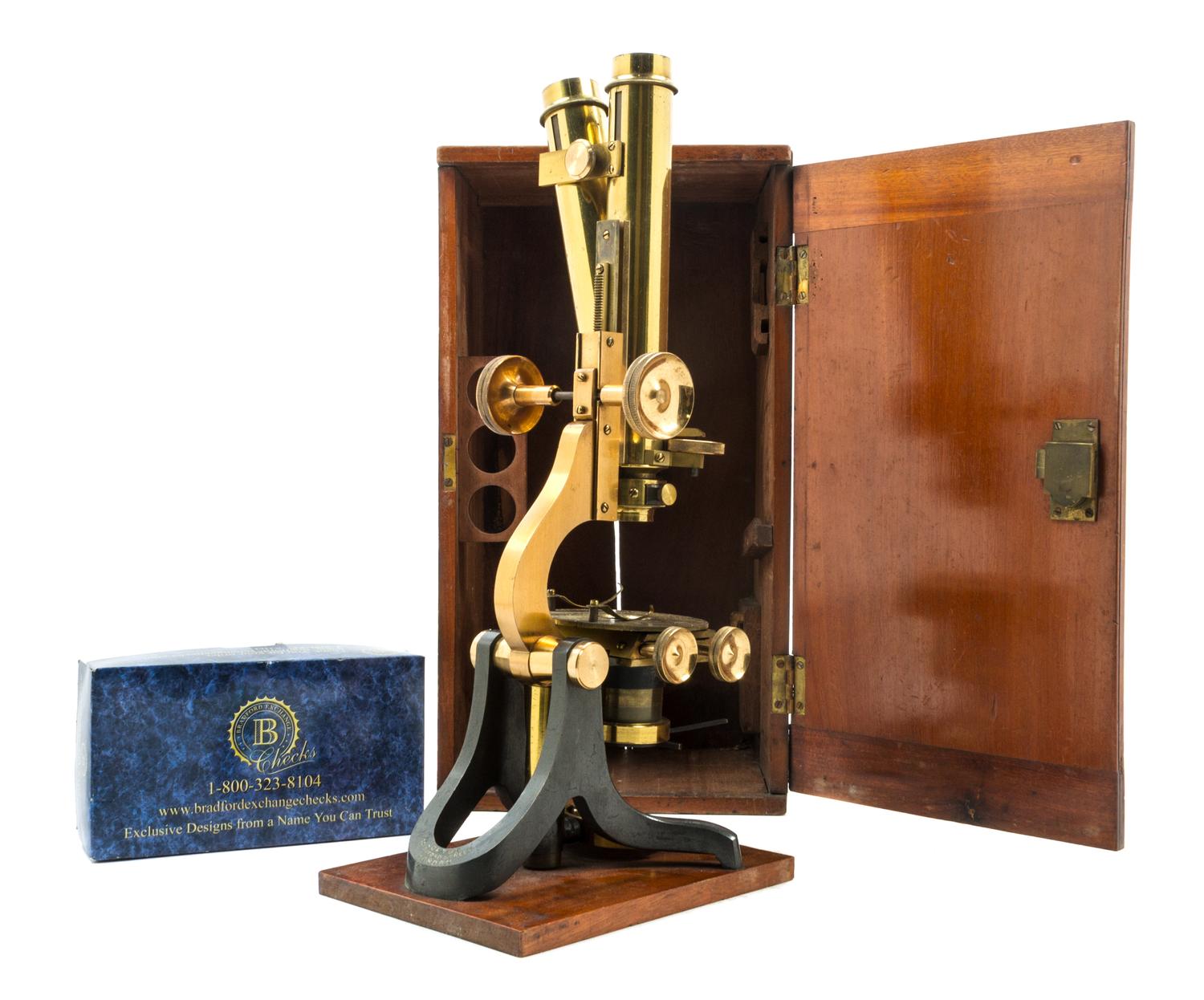 An English Brass and Black Lacquered Binocular Microscope Height 13 1/4 inches. — LOFTUS, LONDON, EARLY 20TH CENTURY