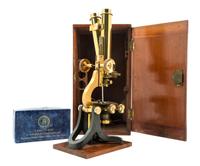 An English Brass and Black Lacquered Binocular Microscope Height 13 1/4 inches. — LOFTUS, LONDON, EARLY 20TH CENTURY