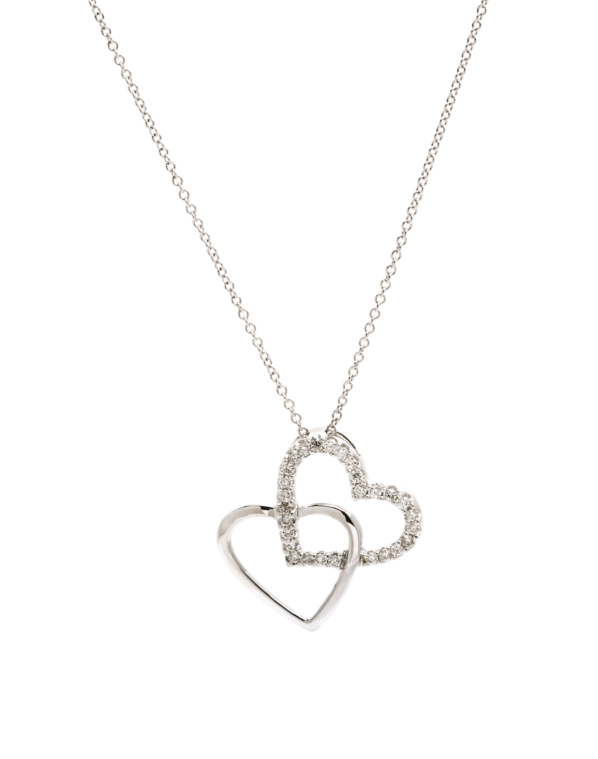 A 14 Karat White Gold and Diamond Double Heart Pendant, 1.90 dwts.