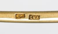A Russian Silver-Gilt and Enamel Spoon, Mark of Sixth Artel, Moscow, early 20th century, having a green and brown enameled finial, the