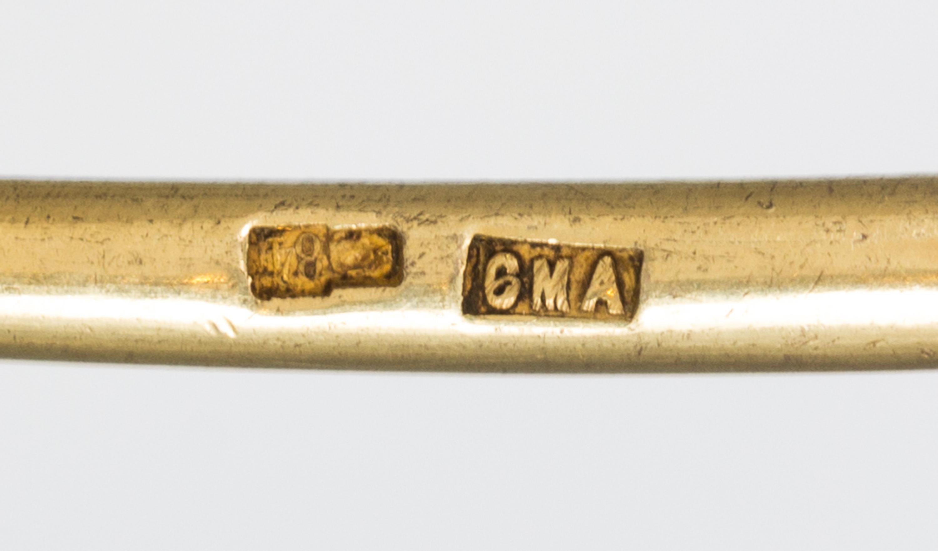 A Russian Silver-Gilt and Enamel Spoon, Mark of Sixth Artel, Moscow, early 20th century, having a green and brown enameled finial, the