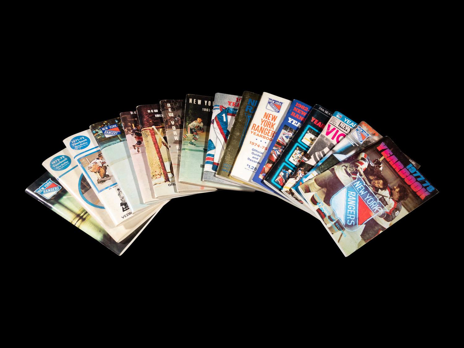 A Group of 16 1960s - 1980s New York Rangers Blue Book Media Guides,
