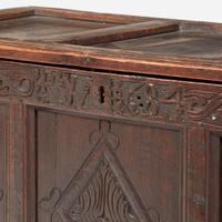 A James II carved oak coffer, dated "1684"