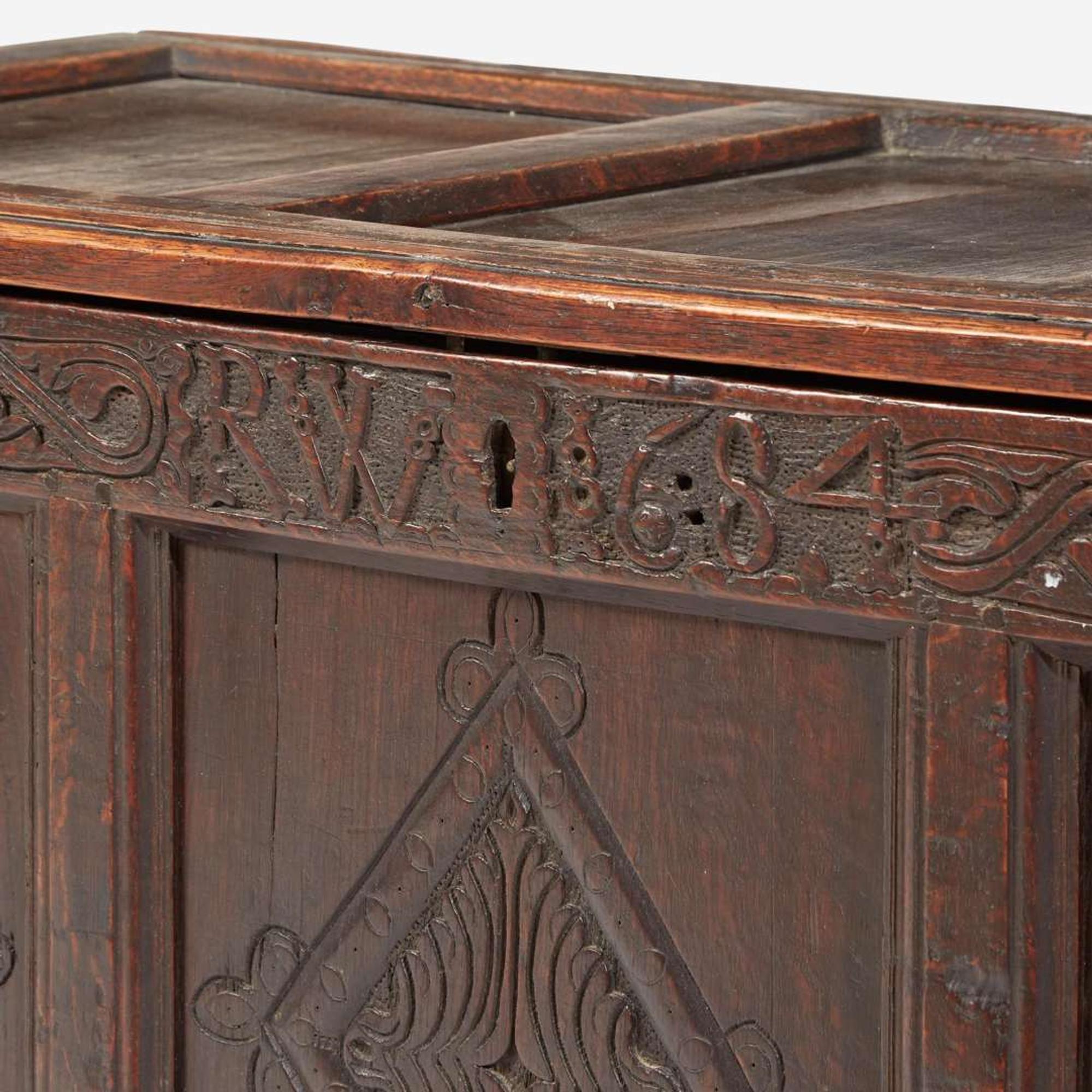A James II carved oak coffer, dated "1684"