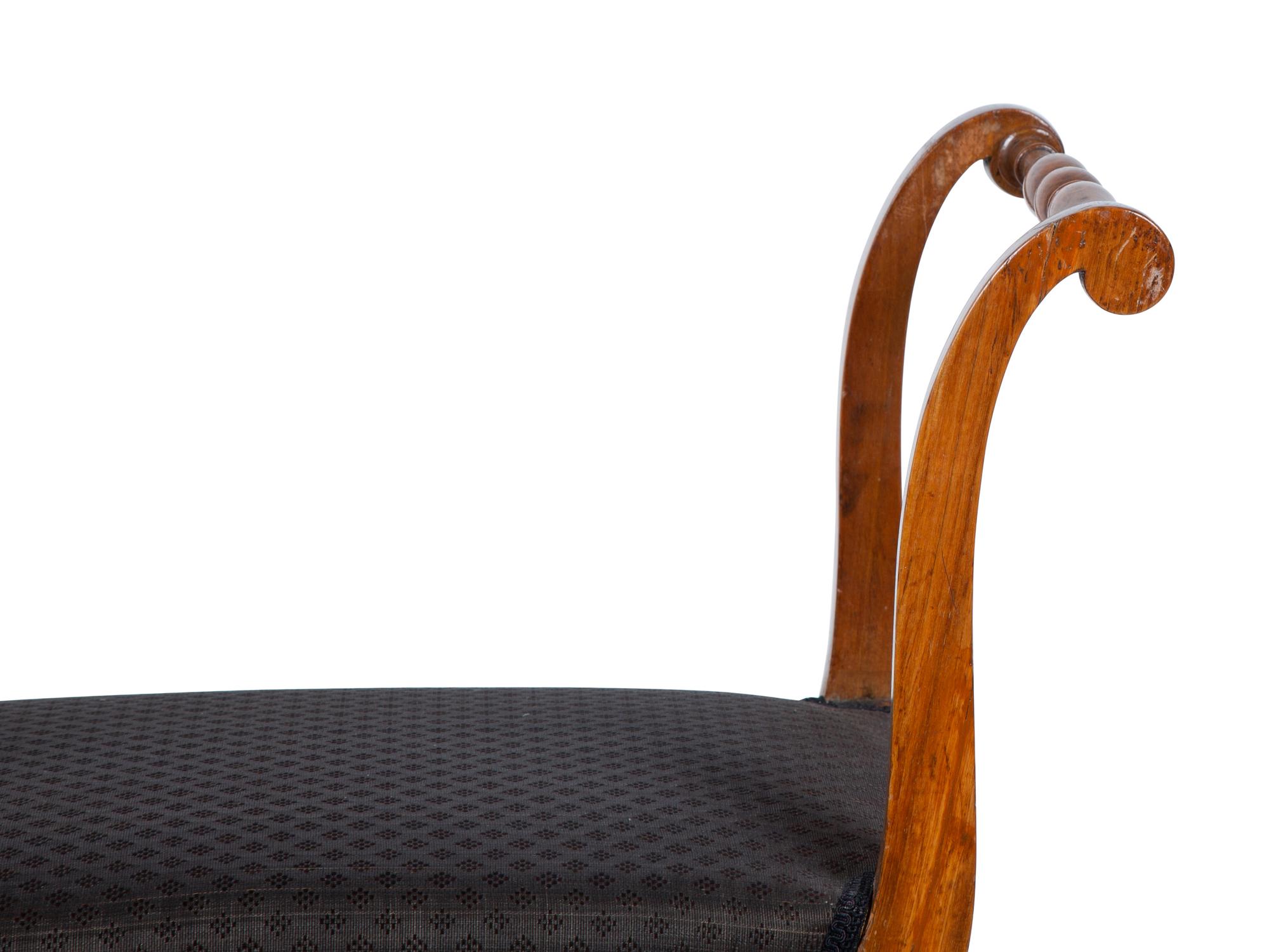 A Continental Walnut Curule Bench — 19TH CENTURY