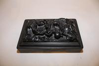 A Chinese Carved Ink Stone. Length 9 1/2 inches.