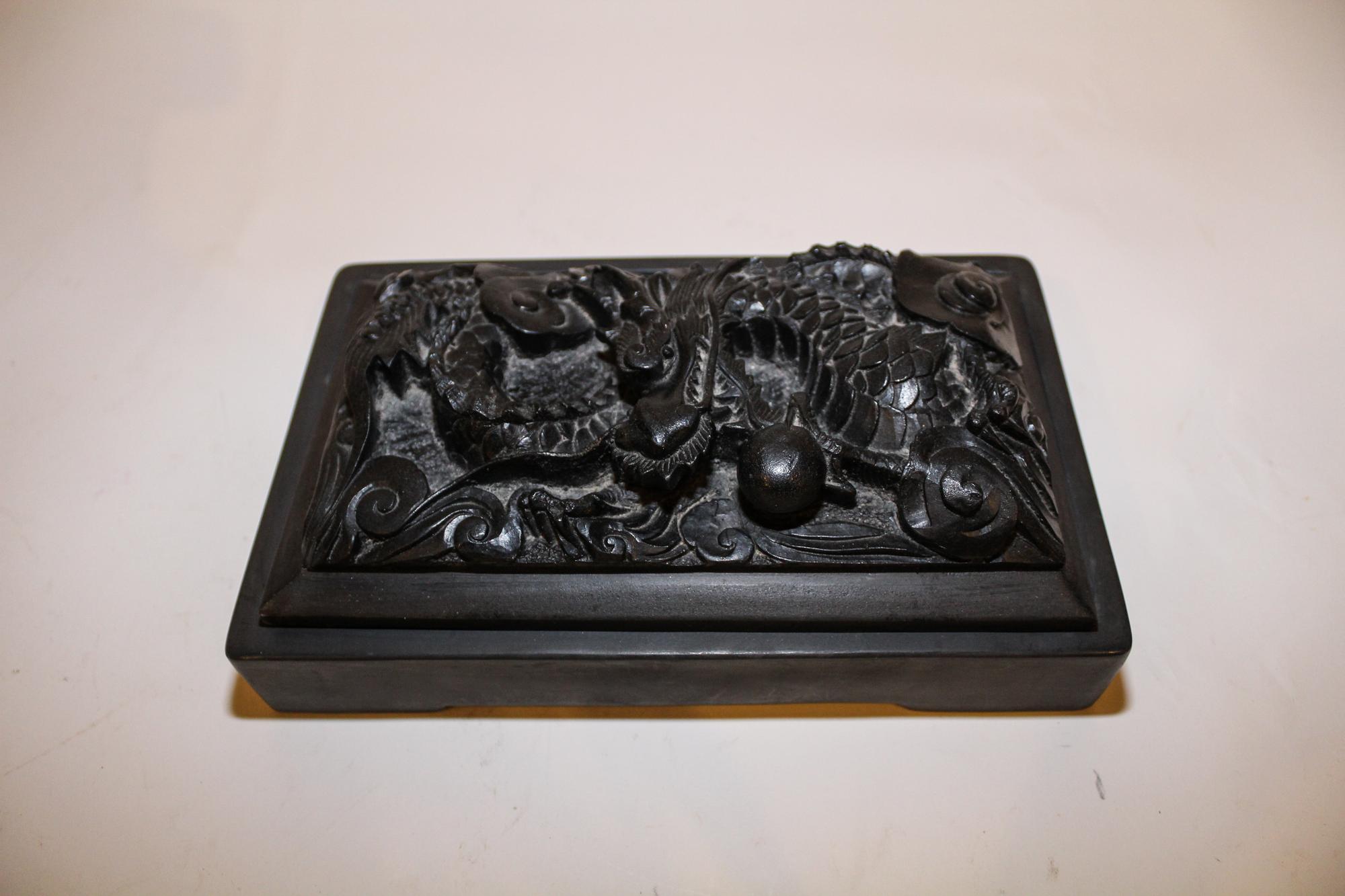 A Chinese Carved Ink Stone. Length 9 1/2 inches.