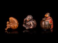 Three Japanese Carved Boxwood Figural-Form Netsuke