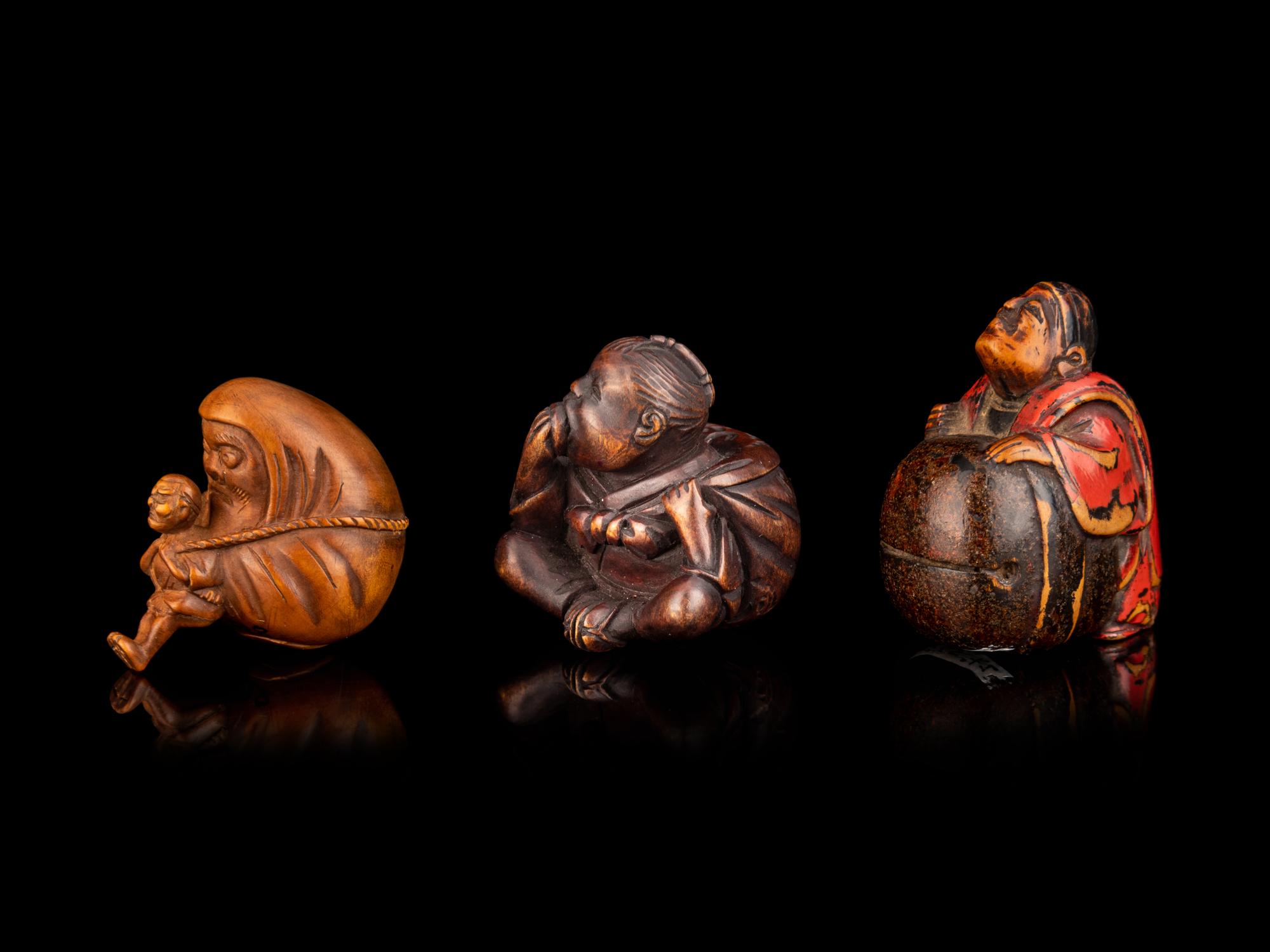 Three Japanese Carved Boxwood Figural-Form Netsuke