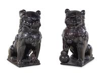 A Large Pair of Chinese Brown Glazed Stoneware Figures of Fu Lions