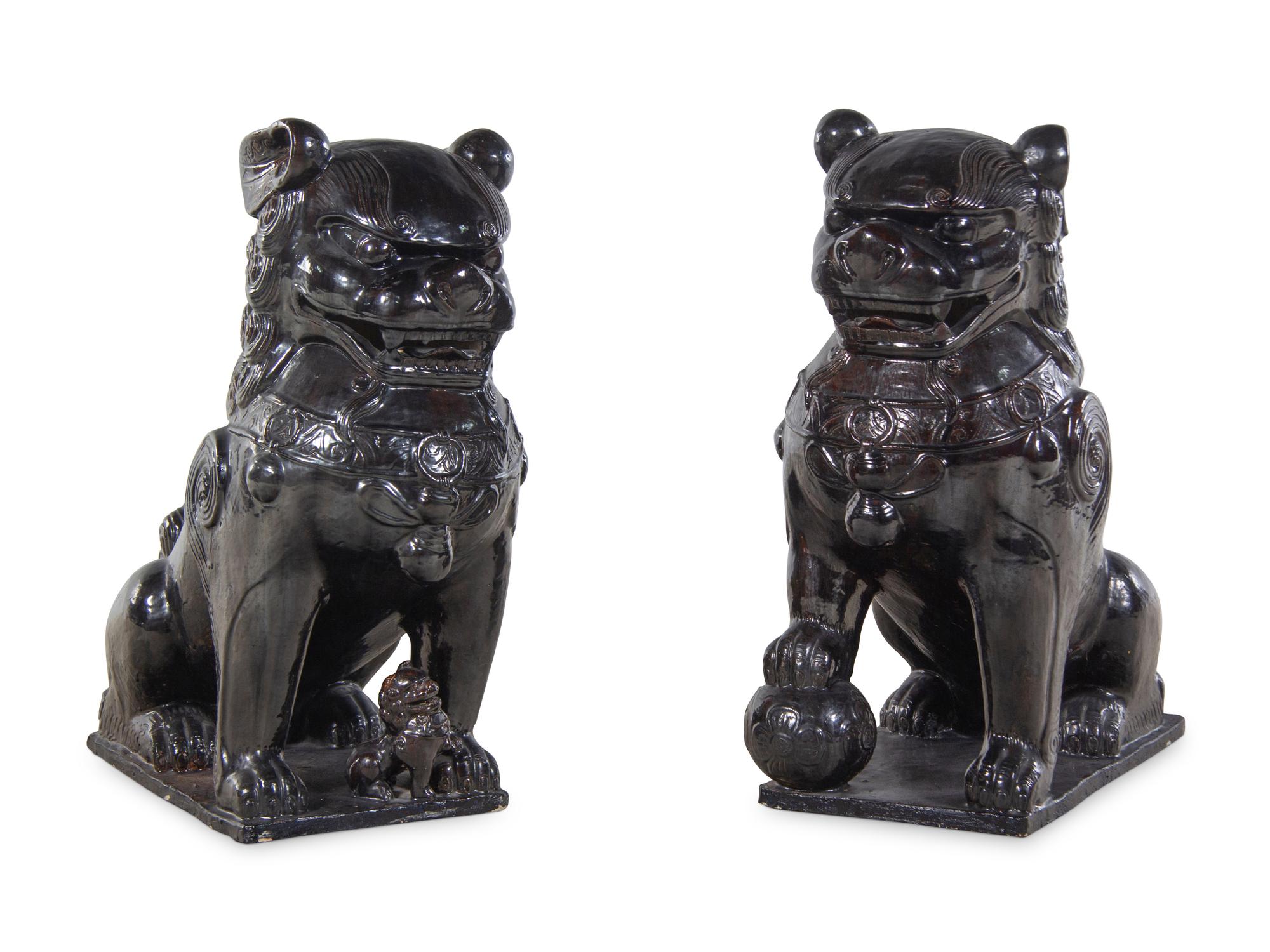A Large Pair of Chinese Brown Glazed Stoneware Figures of Fu Lions